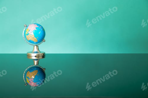 Preview: World globe on green background. Earth day or environment conservation concept.Save planet concept