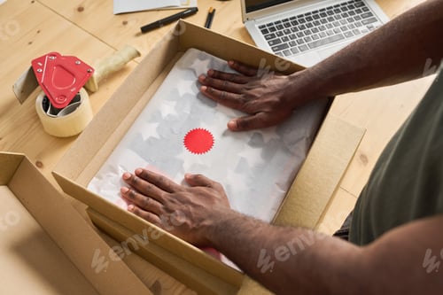 Preview: Man packing the order in box