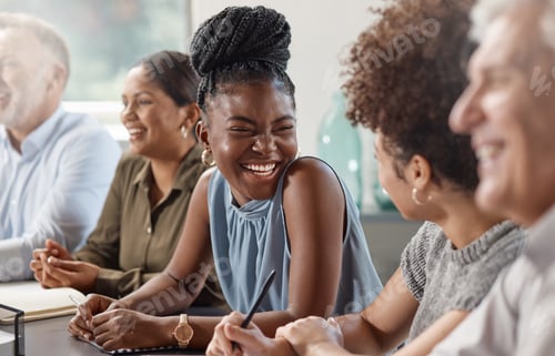Preview: Laughter can brighten up your day. Shot of a group of businesspeople in a meeting at work.