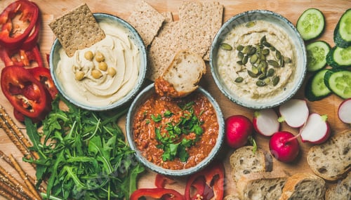 Preview: Flat-lay of Vegetarian dips hummus, babaganush, muhammara