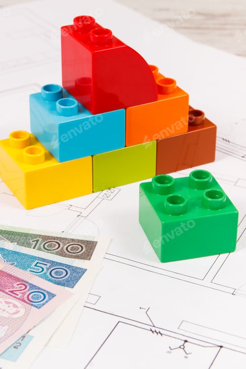 Preview: Colorful Construction Blocks and Currency on Blueprint