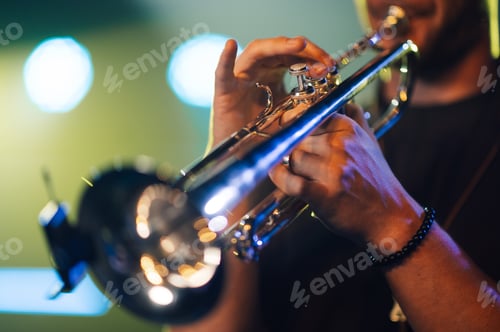 Preview: Musician playing trumpet on stage during concert