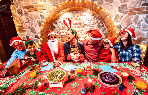 Preview: Group of multi generation large family with santa hats clothes having fun at Christmas fest