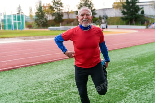 Preview: Joyful Senior Runner Enjoying a Sprint on Athletic Field