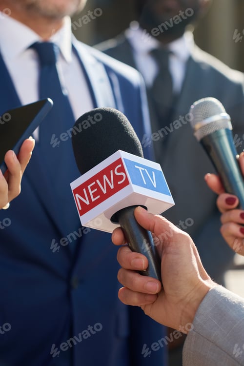 Preview: Caucasian Middle Aged Man Giving Interview to Journalists Holding Microphones