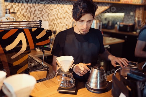 Preview: Barista at work in a coffee shop