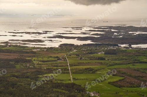 Preview: Beautiful coastline with a dramatic cloudy sky in the background, Norway, the Atlantic Ocean Road
