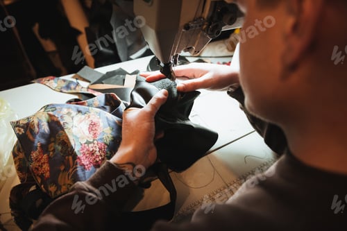 Preview: Cropped photo of young man shoemaker