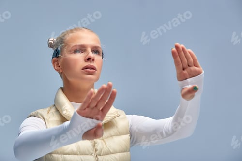 Preview: Smart glasses and augmented reality concept. Woman wearing modern spectacles with futuristic screen