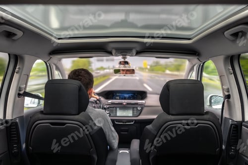 Preview: Man driving car on highway. Focus and motion during travel.