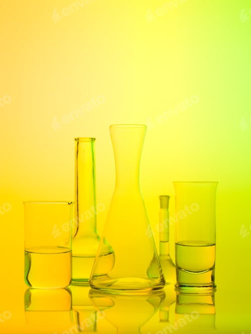 Preview: laboratory glass recipients on yellow background