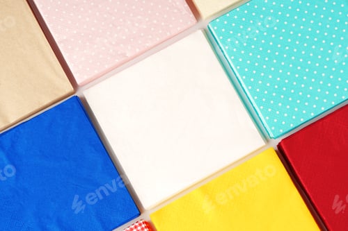 Preview: Colorful square paper napkins background top view