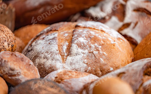 Preview: Freshly baked natural bread is on the kitchen table.