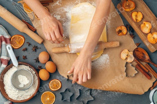 Preview: Woman's hands preparing dough for cookies close up