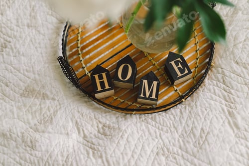 Preview: Cozy home. Still life in the living room with wooden inscription home.