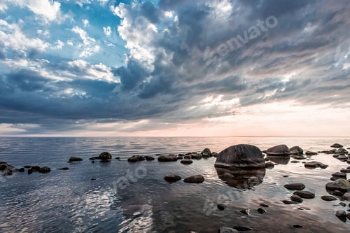Preview: Colorful sky and stony beach at sunset lights. ❤️ nominated 💔