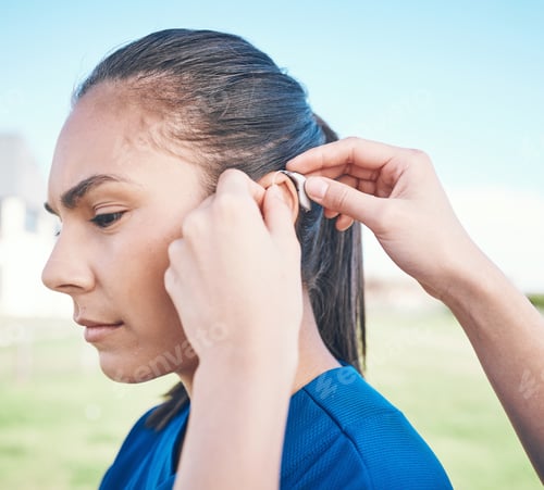 Preview: Hands, profile and woman in hearing aid, ear and sound amplifier at park outdoor. Help, person with