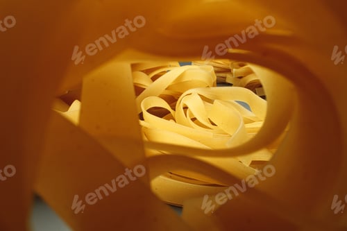 Preview: Dry pasta on dark background macro photo