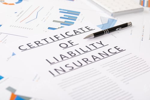 Preview: certificate of liability insurance concept , documents on the desktop