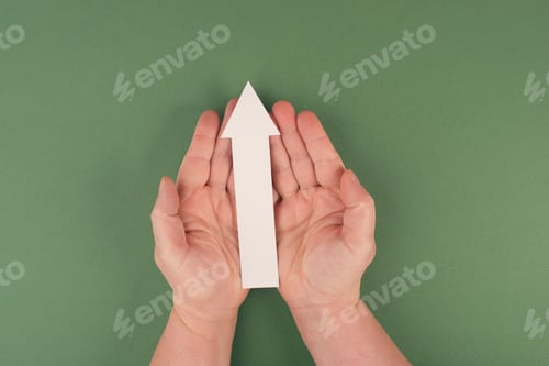 Preview: Holding an arrow in the hand, symbol for growth, success and development