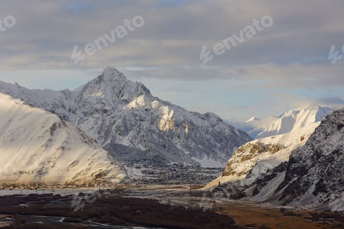 Preview: Picturesque winter landscape with serene snowy mountains in Georgia, Stepantsminda