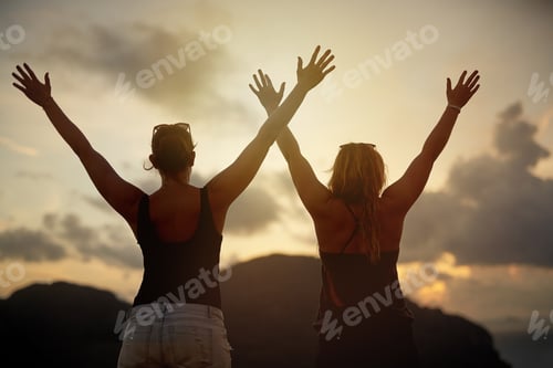 Preview: Raising their hands to the sunset