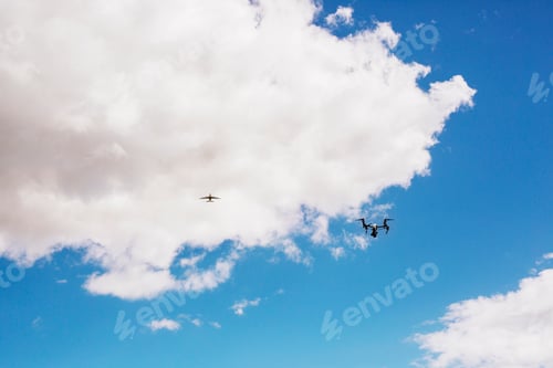 Preview: Low angle view of drone and airplane flying