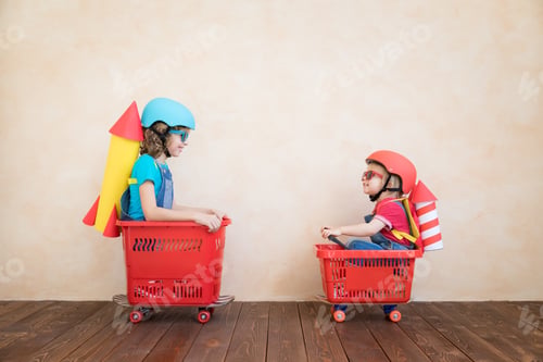 Preview: Happy children driving toy car at home