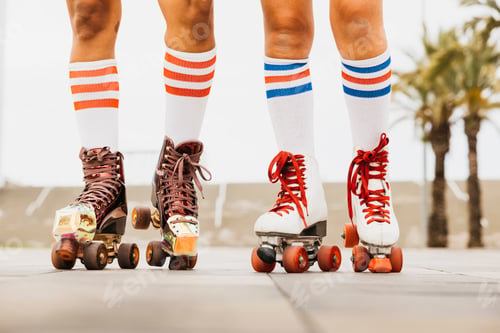 Preview: Two women with roller skates.