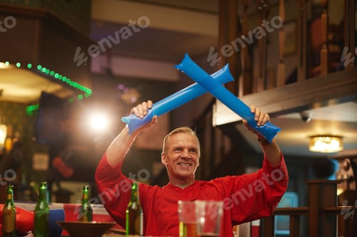 Preview: Mature man cheering for football team