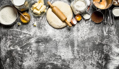 Preview: Dough background. Fresh dough with a variety of ingredients on rustic background.