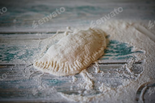 Preview: Homemade Chebureks Are Cooked On The Table With Flour
