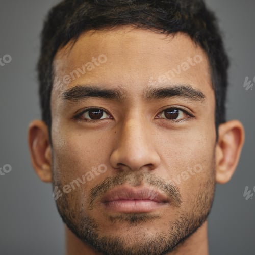Preview: Shot of a handsome young man standing against a grey background