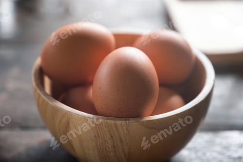Preview: Boiled eggs in wooden bowl for breakfast