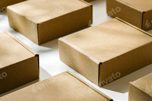 Preview: Brown cardboard boxes arranged on a light surface for packing goods in a warehouse setting