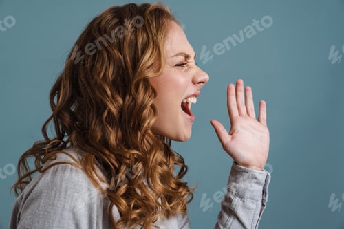 Preview: Irritated beautiful blonde girl gesturing an screaming aside