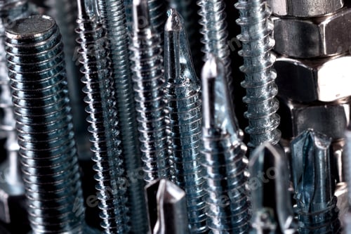 Preview: A fantastic city made of bolts, nuts, screws and self-cuts on a black background with reflection