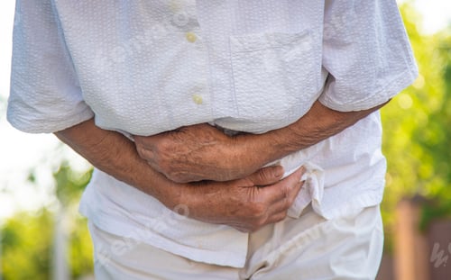 Preview: The old woman grandmother has a stomach ache. Selective focus.