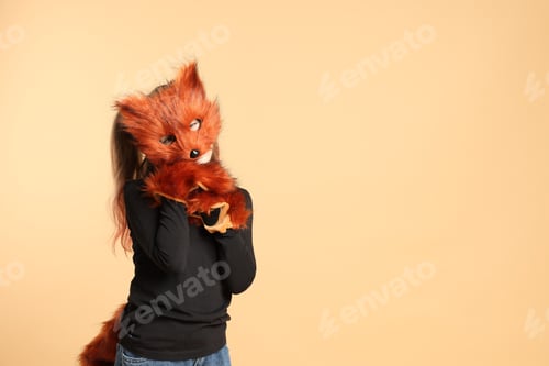 Preview: Quadrobics. Girl wearing fox mask, tail and gloves on beige background, space for text