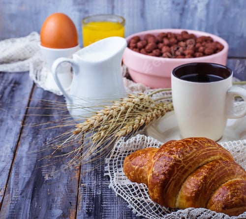 Preview: Croissant, cereal flake, coffee, milk, orange juice, boiled egg for breakfast