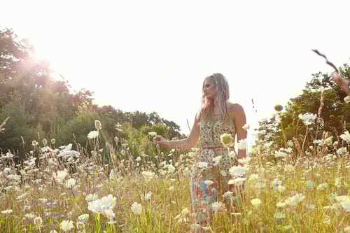 Preview: Woman in field of wildflowers