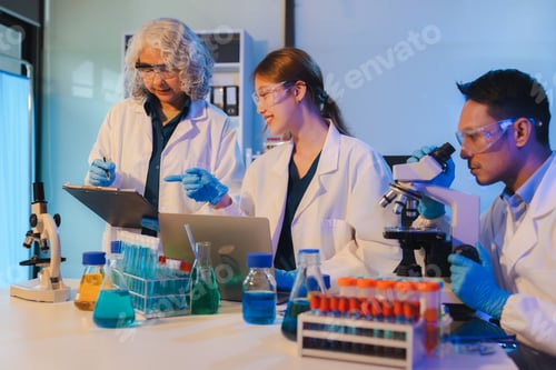 Preview: Scientist mixing chemical liquids in the chemistry lab.