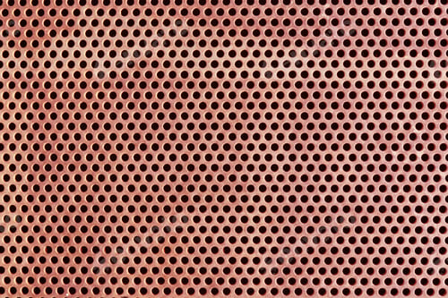 Preview: background image of a reddish grid with a pattern of round holes