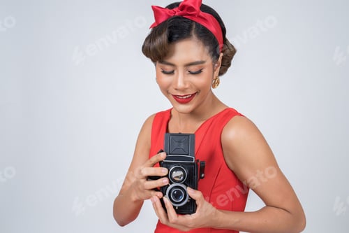 Preview: Happy fashion woman photographer hands holding retro vintage camera