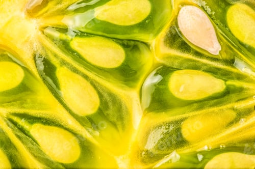 Preview: Kiwano or Horned Melon (Cucumis metuliferus) sliced in a half on white background isolated closeup