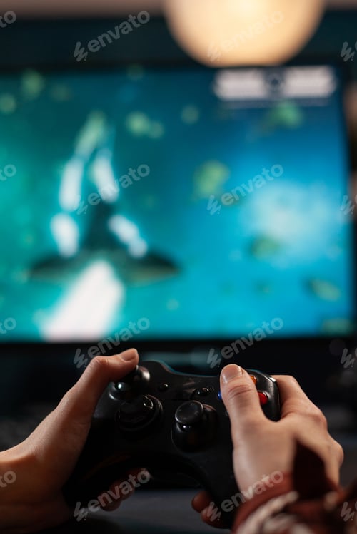 Preview: Close up of woman holding joystick and playing video games