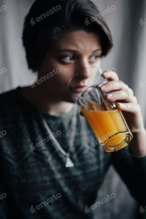 Preview: girl drinking orange juice