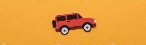 Preview: top view of paper cut car on orange background with copy space, panoramic shot