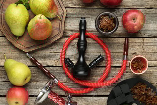 Preview: Hookah, coal and fresh fruits on wooden table, flat lay