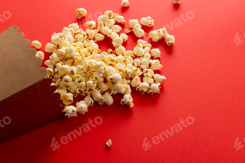 Preview: Image of pop corn lying on red surface